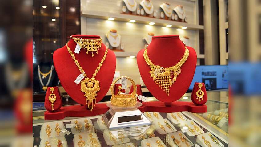 Gold likely to stay high as weak rupee and global demand lift prices: Report