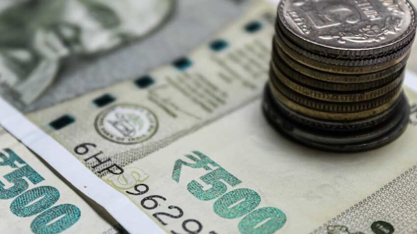 Rupee hits record low vs dollar as global tensions shake currency outlook: Report