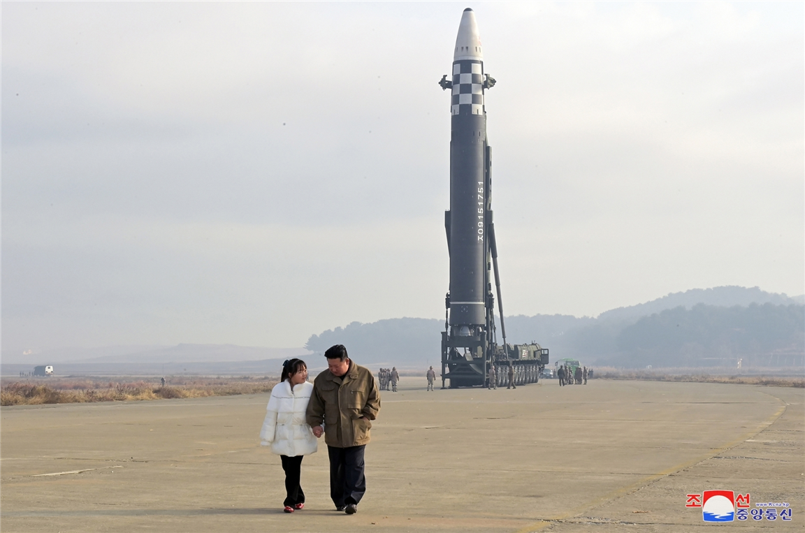 North Korean leader Kim Jong-un alongside his daughter, views a new type of the Hwasong-17 intercontinental ballistic missile (ICBM) during on-site inspection of missile launch at Pyongyang International Airport (Pic: IANS)