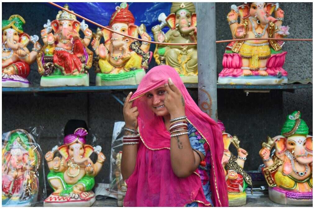 New Delhi: An artisan waits for customers to sell Ganesha idols, ahead of the festival of ''''Ganesh Chaturthi'''', in New Delhi, Tuesday, Aug 30, 2022. (PTI Photo/Shahbaz Khan)