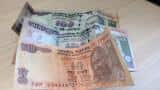 Rupee trades lower by 12 paise against dollar in early trade