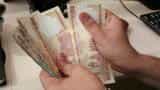 Rupee falls 4 paise against dollar on sustained demand of US currency