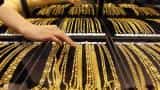 Gold extends losses, hits nearly one-month low on global cues