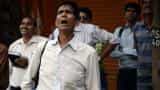 Sensex closes down 71 points after volatile trade