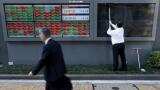 Asian shares edge up, Kiwi rises as central bank keeps interest rates unchanged