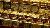 Gold edges up in early trade, set for third straight weekly gain
