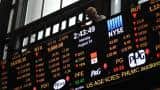 Asian shares step back as investors ponder stimulus outlook