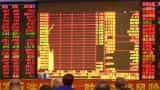 Asian shares open lower as Feds kept rates unchanged