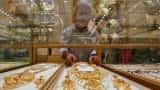 Gold edges higher as dollar dips, US Fed in focus 