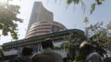Sensex, Nifty close flat, cede gains on profit booking