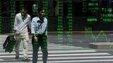 Asian shares firm in countdown to China data