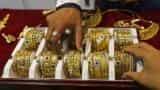Gold slips as dollar climbs to 14-year high