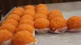 Stand in line at ATMs get a laddoo from BJP govt
