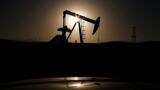 Oil prices edge up despite unexpected U.S. crude inventory build