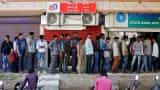 Indians line up at banks to deposit savings or see them disappear on last day of exchange on December 30
