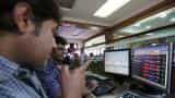 Sensex, Nifty open marginally lower; Ambuja Cement, HUL in focus