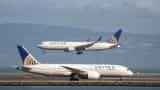 United Airlines under fire after passenger dragged from plane; officer put on leave