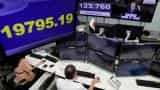 Asian shares, yuan down after Moody's downgrades China