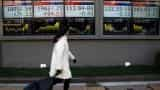 Asia stocks edge up on firmer Wall Street, pound nurses losses