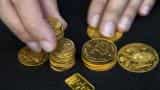 Gold firm near one-month highs as geopolitical concerns support
