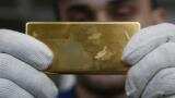 Gold holds near five-week highs, but potential U.S. rate hike drags