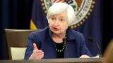 Fed raises rates, unveils cuts to bond holdings in sign of confidence