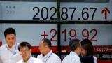 Asian shares dip on profit-taking after Dow hits 22,000