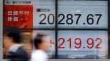 Asian shares edge up, bolstered by modest gains on Wall Street