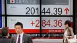 Asian markets edge up slightly after strong US service data