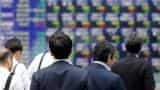 Asia shares reach decade top on China data, dollar in doldrums