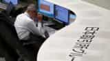 Asian shares slip as iron ore softens, euro near three-year top