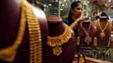 Gold futures trade below Rs 30,000 on weak global cues