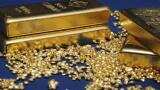 Gold hits one-week low on strong dollar; Fed minutes awaited