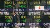Asian markets step back as investors brace for US Fed outcome