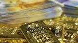 Gold slips on stronger dollar; U.S.-China trade war fears loom