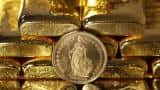 Gold steady as strong dollar counters concerns over US-China trade spat