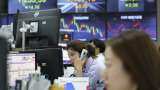 Asian markets stay near 9-month lows as trade frictions weigh