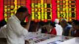 Sliding yuan hits world stock markets, stokes trade war fears