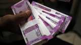 Rupee touches record low of 69.50 against dollar; Sensex, Nifty also down