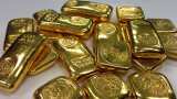 Gold prices sink to 19-month low amid strong dollar