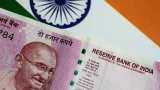 Indian Rupee rises from record low, recovers 23 paise against US dollar Indian Rupee rises from record low, recovers 23 paise against US dollar
