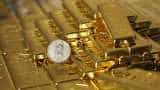 Gold edges down as US Fed''s interest rate view strengthens dollar