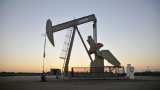 Oil slips back towards 18-month lows on oversupply