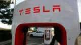 Tesla posts massive $702 million loss last quarter