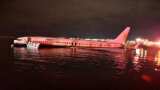 In PICs: Boeing 737 slides off runway into Florida river; probe begins In PICs: Boeing 737 slides off runway into Florida river; probe begins