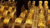 Gold firms as Sino-US trade spat dents risk sentiment