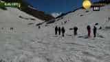 Tourists enjoy snow during summer vacations in Kullu