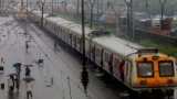 Mumbai rains hit road, rail and flight services; IMD forecasts wet spell set to continue Mumbai rains hit road, rail and flight services; IMD forecasts wet spell set to continue