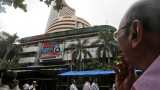 Sensex, Nifty pare early loss on Amit Shah&#039;s article 370 move; US-China trade war still looms