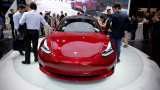 Tesla begins deliveries of China-made Model 3 cars